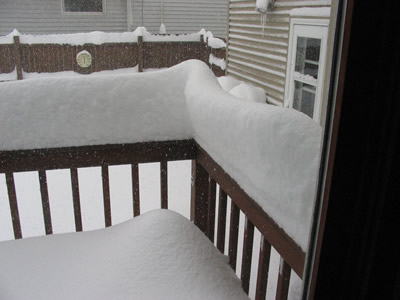 A Snowy Deck Railing